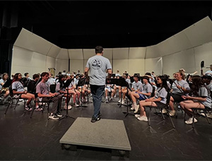 students on stage performing